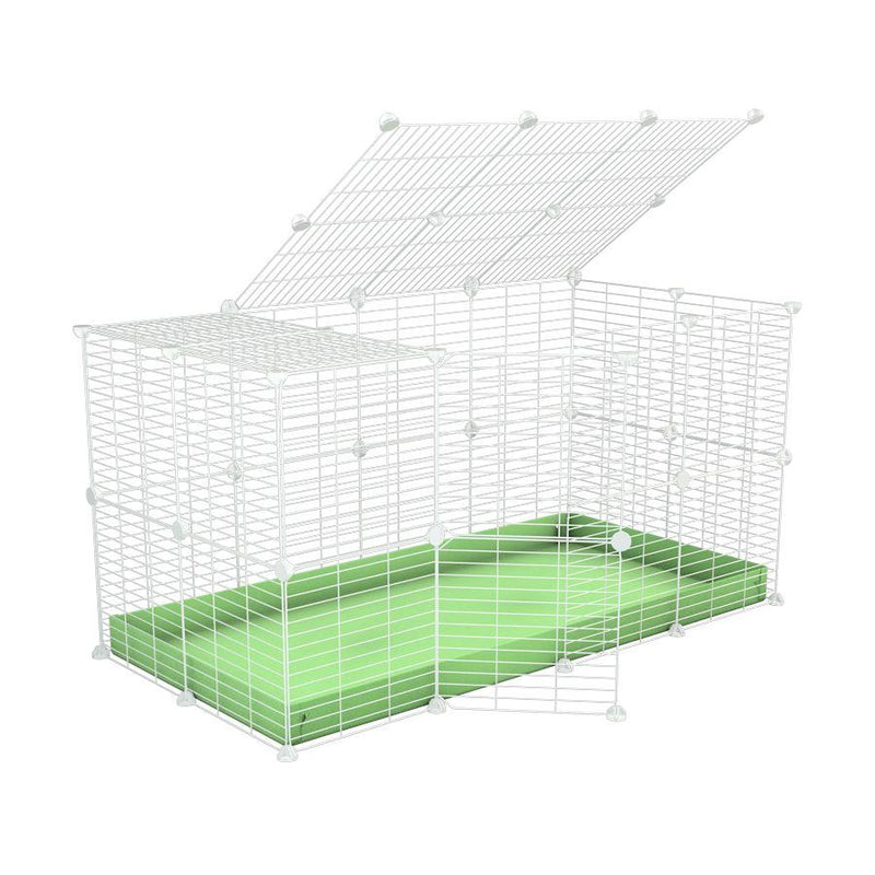 Une cavy cage 4x2 pour lapins avec couvercle un coroplast vert pistache et des grilles blanches a barreaux etroits par kavee