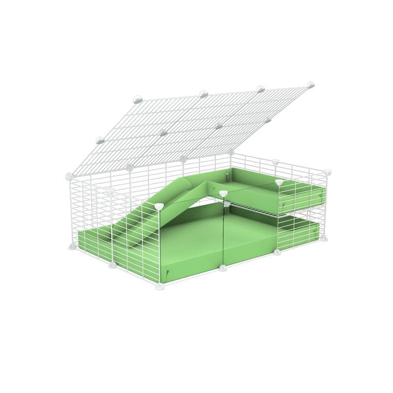 une cavy C&C cage 3x2 pour cochons d'inde avec panneaux transparents en plexiglass avec une rampe un loft un couvercle un coroplast vert pistache et grilles blanches fines