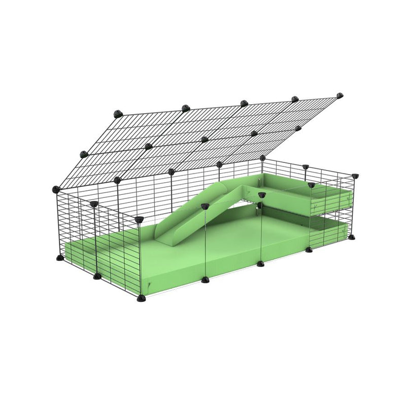 une kavee cage 4x2  avec panneaux transparents en plexiglass pour cochons d'inde avec une rampe un loft un couvercle un coroplast vert pistache grilles