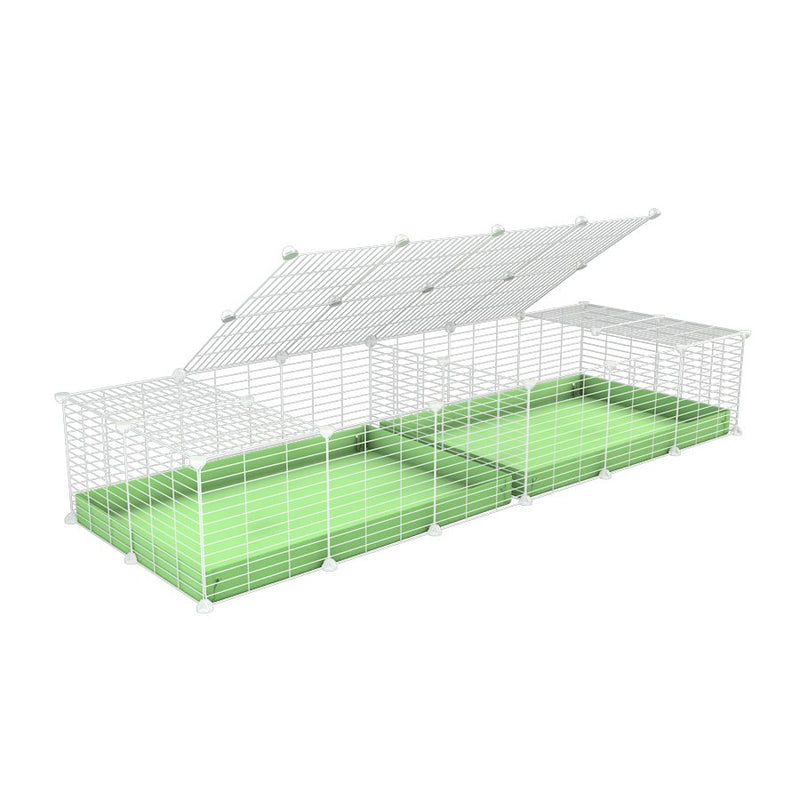 une cavy cage blanche 6x2 avec couvercle et separation pour cochons d'inde qui se battent ou en quarantaine avec coroplast vert kavee