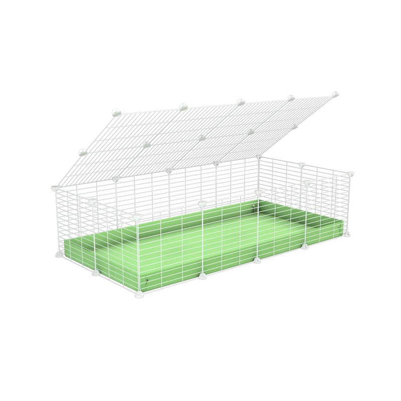 une cavy cage 4x2 pour cochons d'inde avec couvercle coroplast vert et grilles blanches avec barreaux etroits de kavee